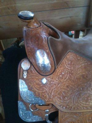 western saddle with tooling and chrome