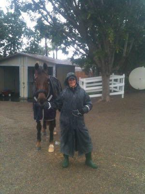 lady and horse in the rain