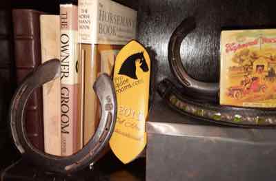 bookcase with horseshoes