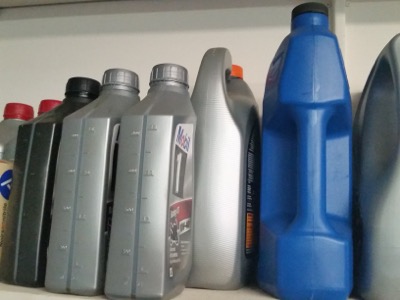 motor oil on a garage shelf