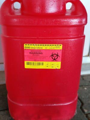 tall red sharps container