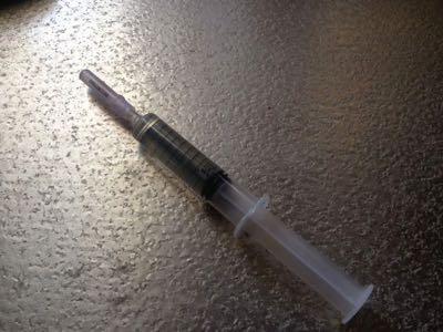 veterinary syringe with needed and cap