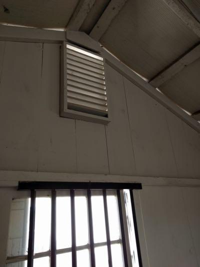 vent in horse stall above a window