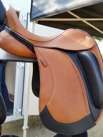 brown and black leather dressage saddle