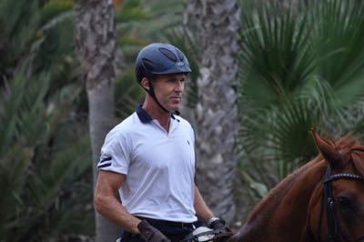 guenter in a riding helmet on a horse