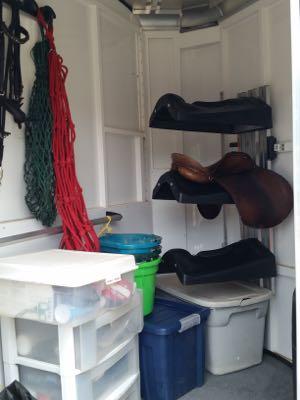 inside of a horse trailer tack room