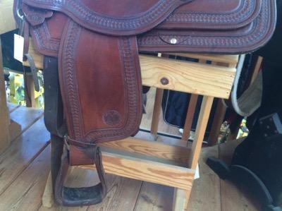 western saddle on a saddle rack
