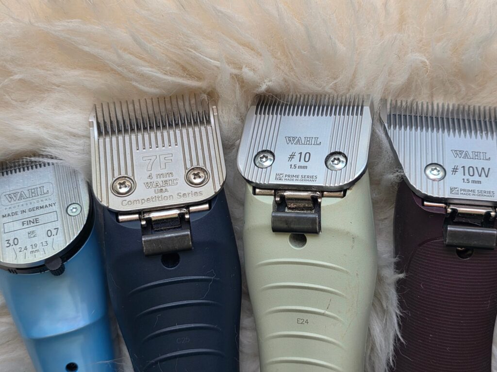 4 clipper blade sizes attached to 4 clipper bodies and trimmer